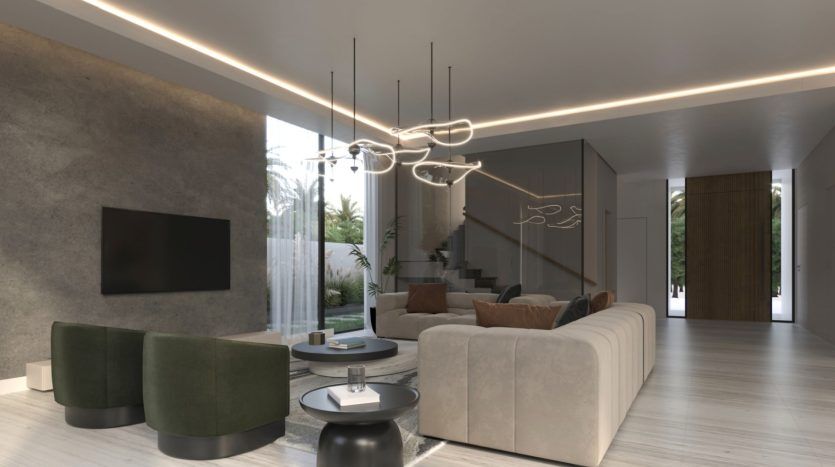 Intérieur de salon moderne avec mur en béton, canapés élégants, éclairage élégant et escalier menant à un autre niveau dans une villa de Dubaï, entouré de grandes fenêtres donnant sur la verdure.