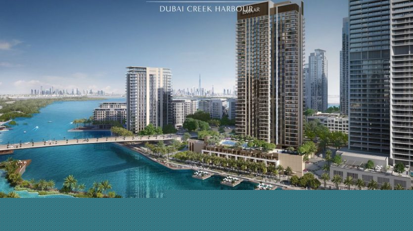 Aerial view of Dubai Creek harbor featuring high-rise buildings next to a bright blue waterfront, with palm trees, boats and a distant city skyline, presenting an ideal opportunity for those looking to invest